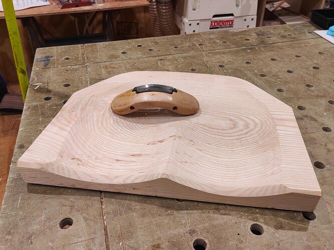 Carved seat with travisher